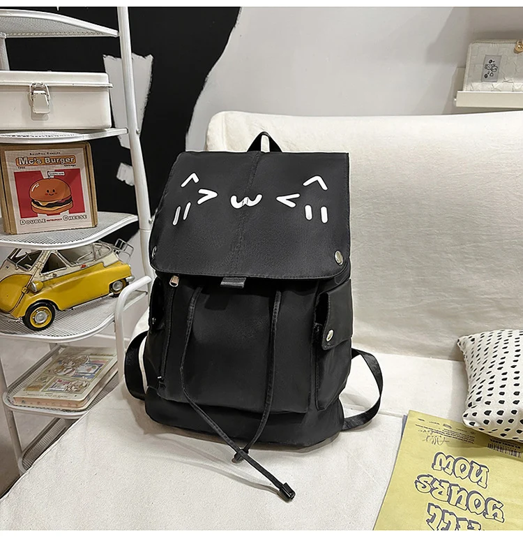 Niedlicher Rucksack mit Cartoon-Gesicht Skanto