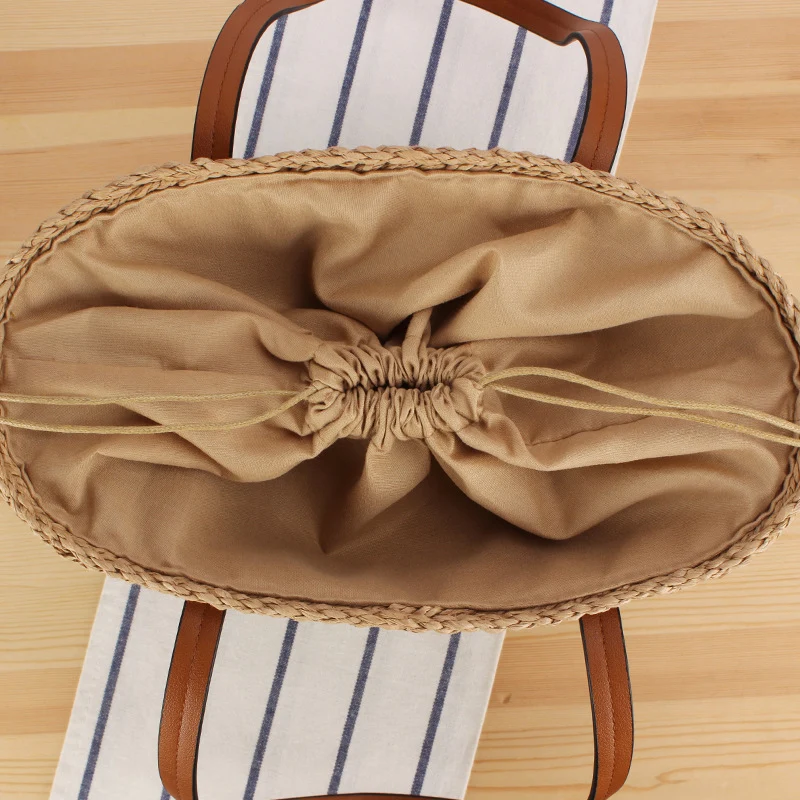 Handtasche aus Naturgeflecht mit Ledergriffen Skanto