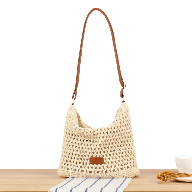 Handtasche aus handgewebtem Naturmaterial mit Lederakzenten Skanto