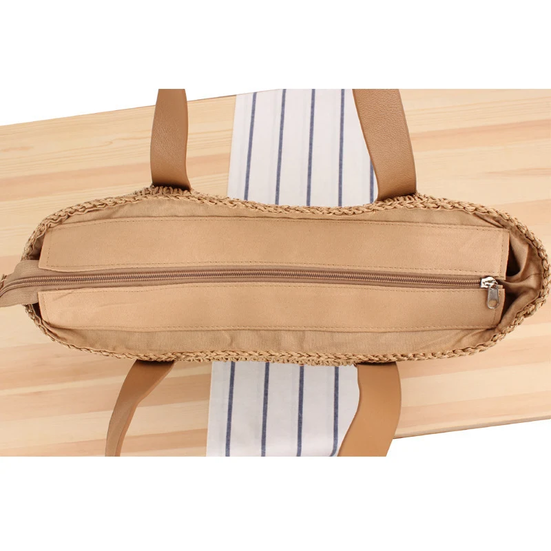 Breite Strohtasche mit eleganten Ledergriffen Skanto