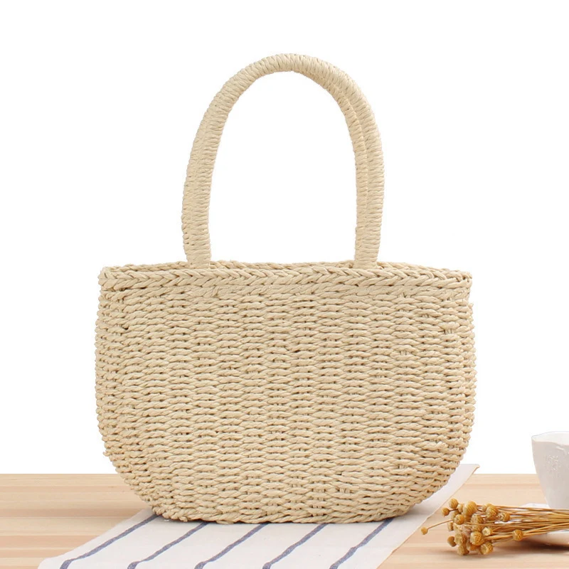 Handtasche aus geflochtenem Naturmaterial mit modernen Details Skanto
