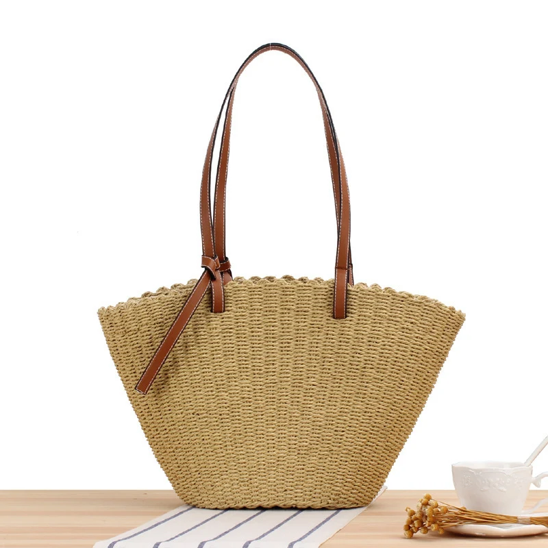 Handtasche aus geflochtenem Naturmaterial mit eleganten Ledergriffen Skanto