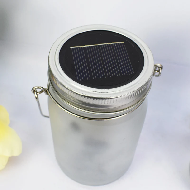 Hängende mattierte Mason Jar Solar-LED-Feen-Silhouette-Laterne mit Seilgriff und dynamischer LED-Lichterkette Skanto