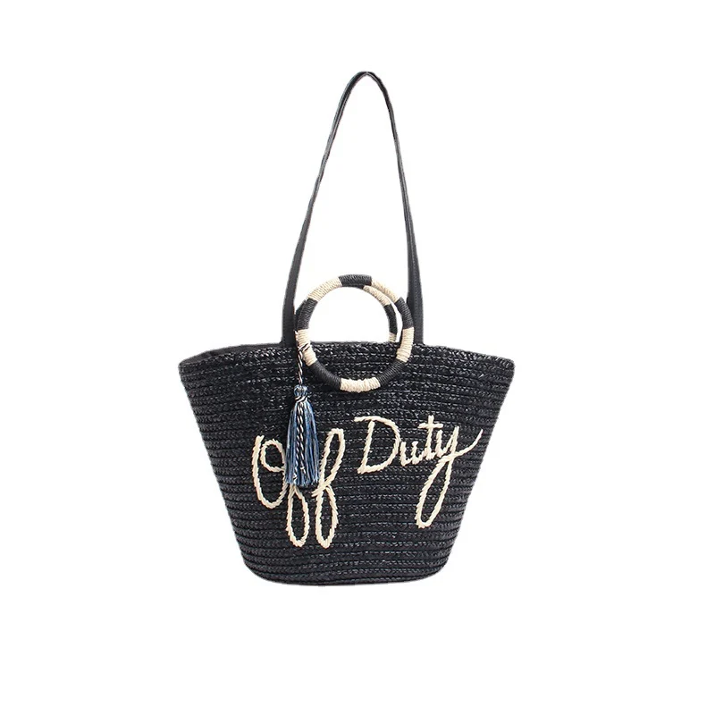 Designer Strohtasche mit verspieltem Text und dekorativem Pompon Skanto