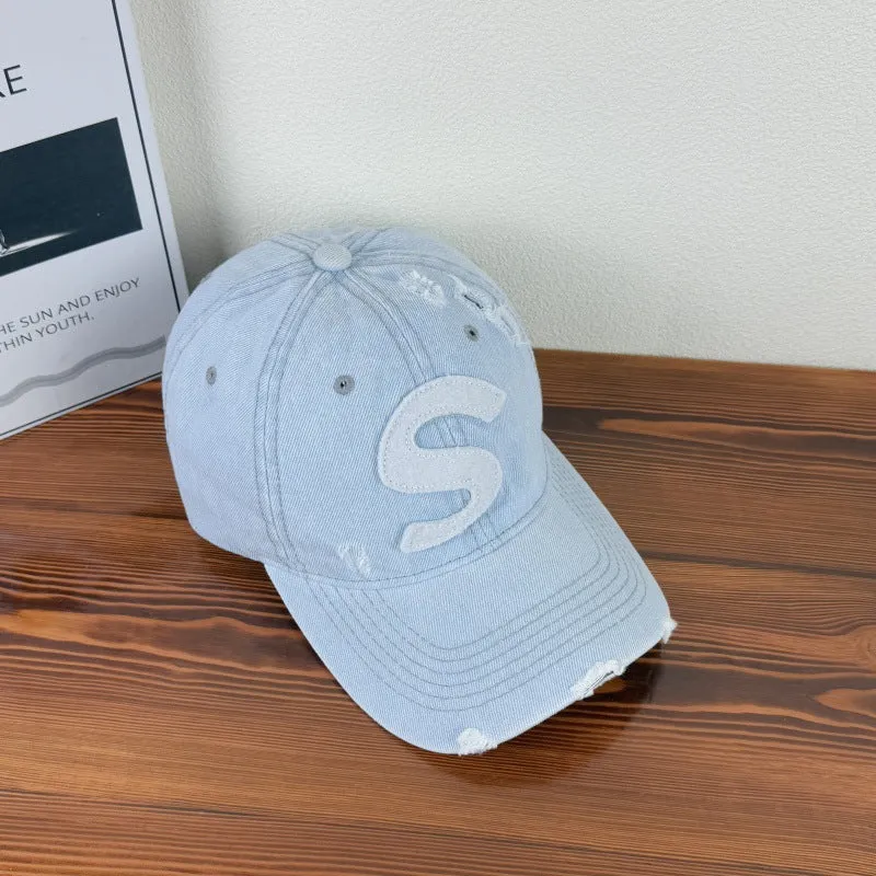 Damen Baseballkappe im Used-Look mit Grafik-Logo Skanto