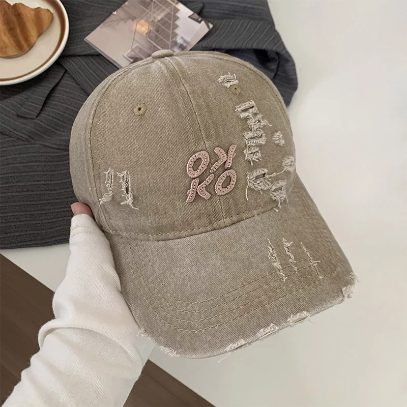 Damen Baseballkappe im Used-Look mit Grafikstickerei Skanto