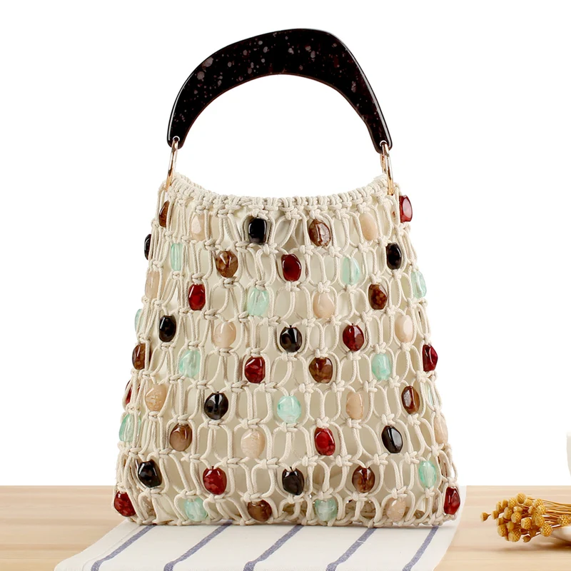 Modische Handtasche im kreativen Netzdesign mit farbigen Akzenten Skanto