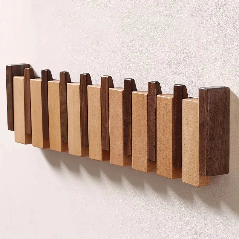 Wandgarderobe aus Holz im Klavierdesign mit klappbaren Haken | Skanto